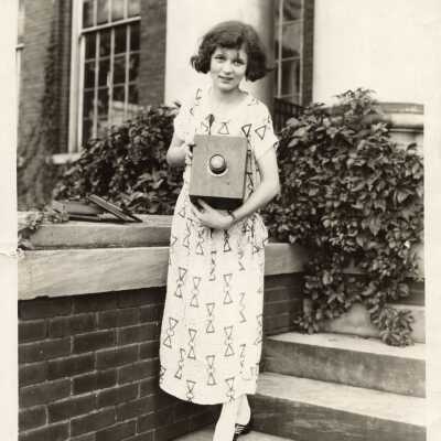 Image of Mary Hardy in 1924 holding the Peter Camera.