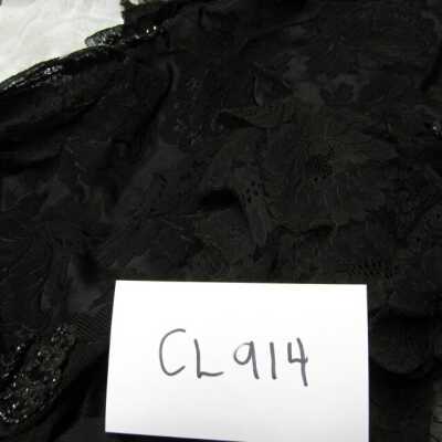 Lace-trimmed black cape