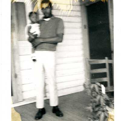 Unidentified Man Holding Child Photograph