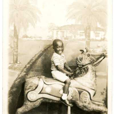 Unidentified Boy Riding Toy Horse Photograph