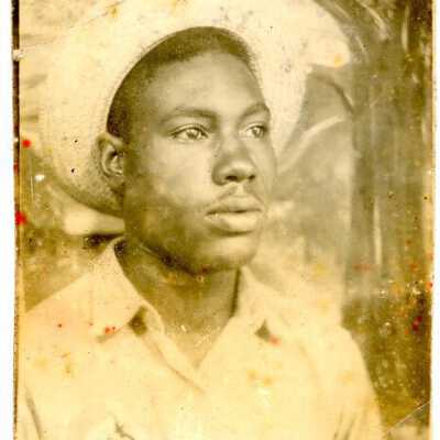 Unidentified Man in Lion Oil Uniform Photograph