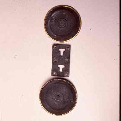 Two circular plates with embossed rosette decoration - silvered -; rectangular plate with T-shape slots. Girdle terminals.: ©National Museums Scotland. Digitised from a positive on film by The Trimontium Trust.