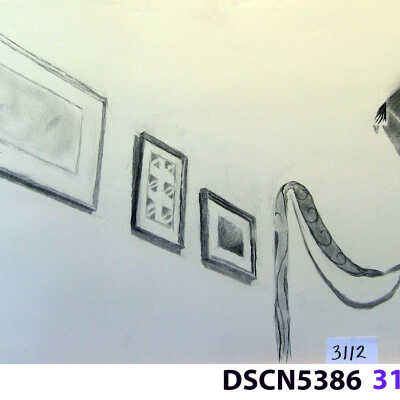 Dining room wall with pictures and kite