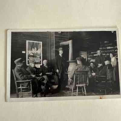 Postcard featuring men around stove in Pendleton Store