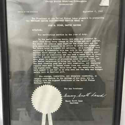 Framed documentation of a merchant Marine Distinguish Service Metal from WWII, John M. Dodge