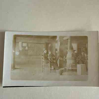 Photo of men around stove in store