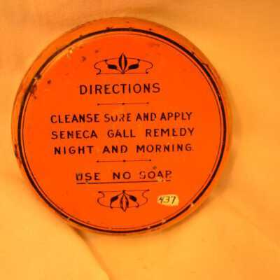 ointment tin, back