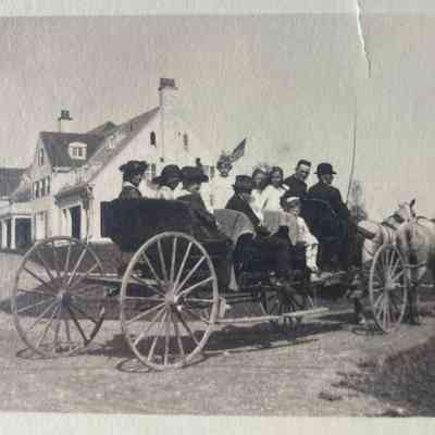 Group out for a carriage ride, undated
