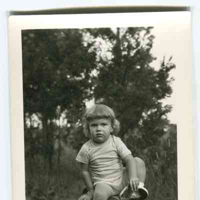Toddler on toy truck, postcard
