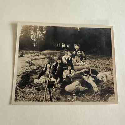Nine girls on beach having a picnic