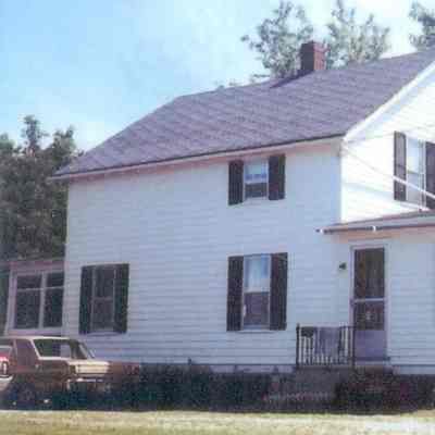2023.21.1.6 Sinnott home in new location at 5785 Shelburne Road, the Northeast corner of Meadow Lane and Shelburne Road. The original front porch is on the left and the single story is an addition after moving.