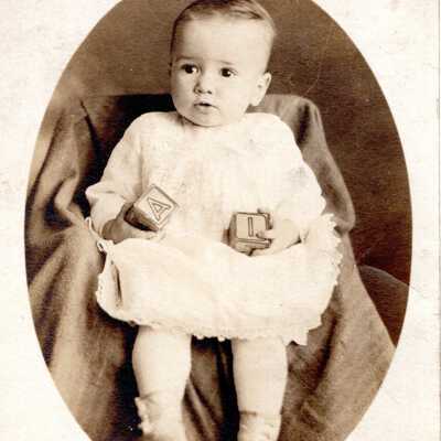 Portrait of a Child Holding Blocks