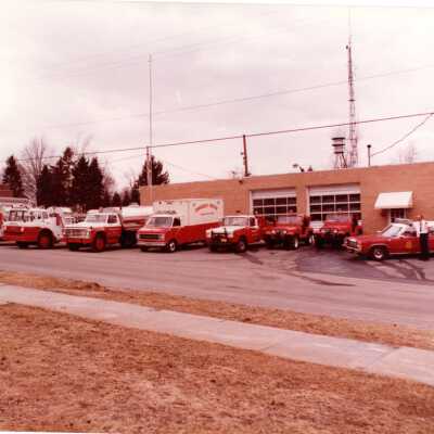 Firetrucks Lined up in Front of Building 1980s