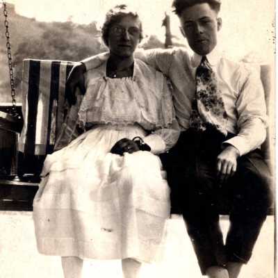 Man and Woman on Bench Swing