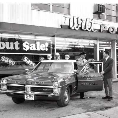 Fire Chief Receiving Keys in Front of Wilt Pontiac