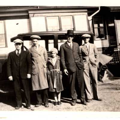 Group of Five People by Car