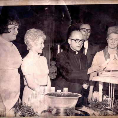 Priest Cutting Cake, Monsignor Reagan