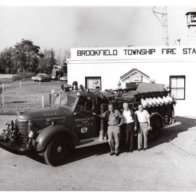 Men Outside Fire Station with Fire Truck 1949