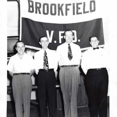 Men in Front of Brookfield V.F.D. Sign