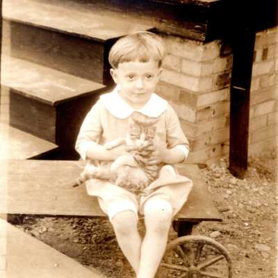 Young Child Holding Cat