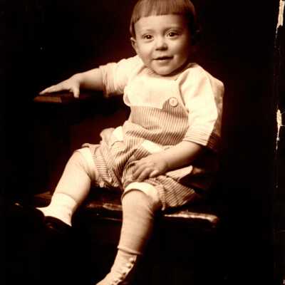 Young Child Sitting in Chair