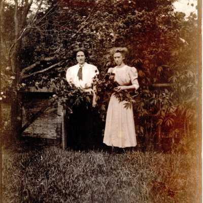 Two Women Holding Flowers