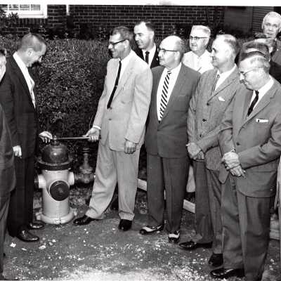 Men Around Fire Hydrant