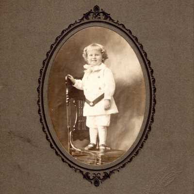 Portrait of a Child on a Chair