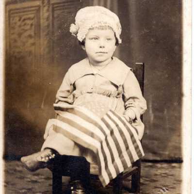 Portrait of a Child Holding a Flag