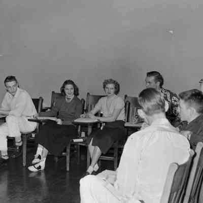 People sitting in school desks