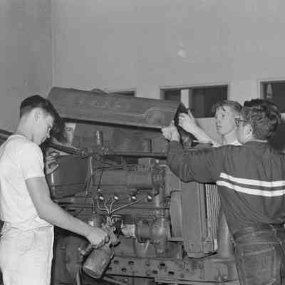 Men working on a tractor