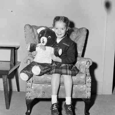 Child and teddy bear