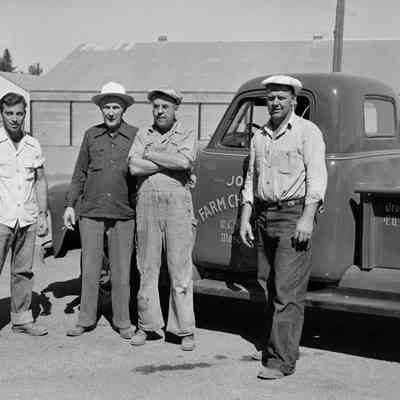 Four men with Jones Chemical truck
