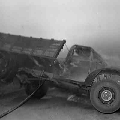 Truck being rolled upright