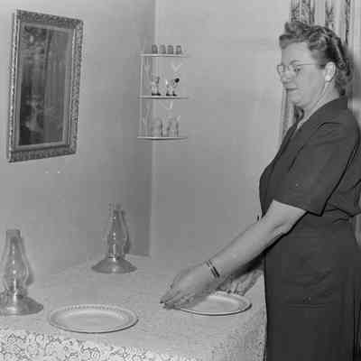Woman setting a table
