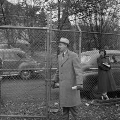 Man opening a gate
