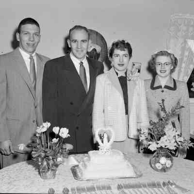 Standing with the wedding cake
