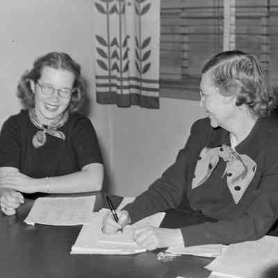 Two women at a desk