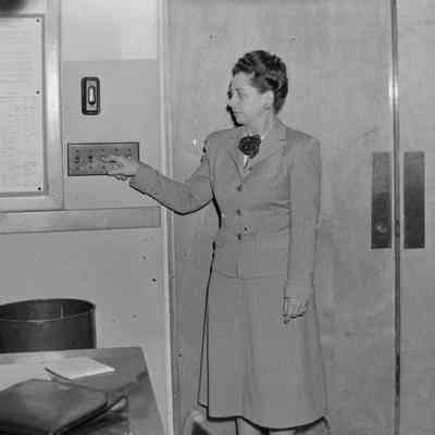 Woman switching the lights off or on