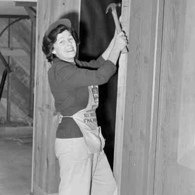 Woman hammering a nail