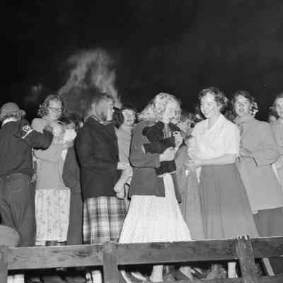 Girls, dolls and teddy bears at the bonfire