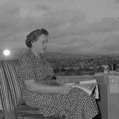 Woman sitting by a window