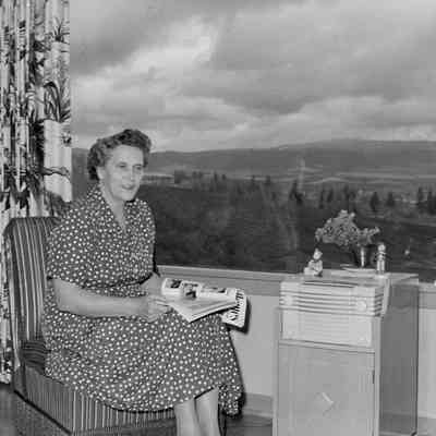 Woman sitting by a window