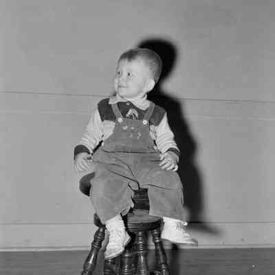 Kid on a stool