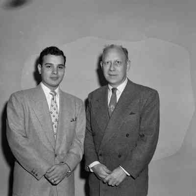 Two men in suits [SIMILAR TO #967]