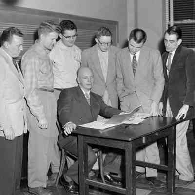 Men looking at a book