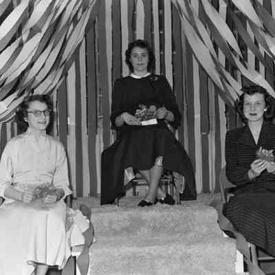 Women sitting on stage