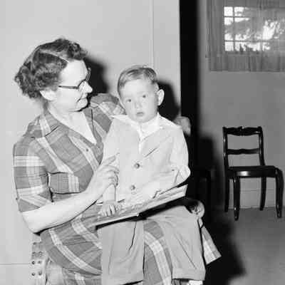 A woman, a boy and a book