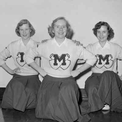 Three cheerleaders