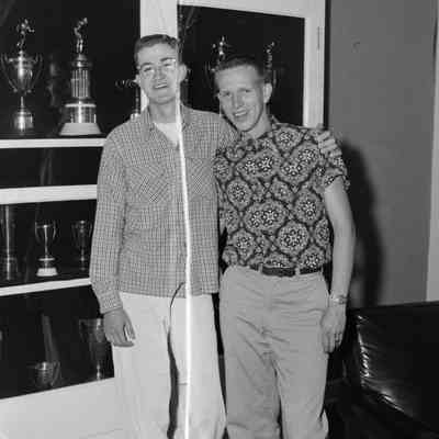 Two young men with trophies